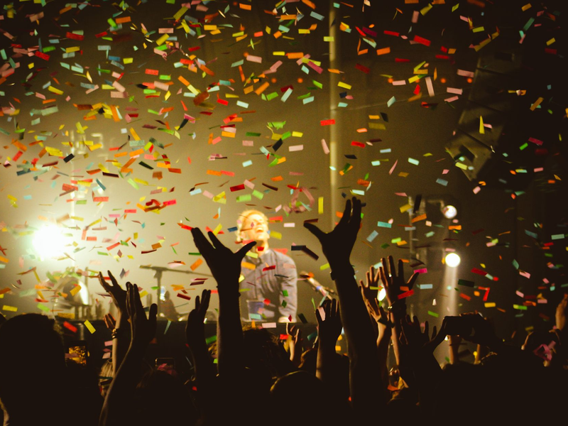 Confetti falling over celebrating guests