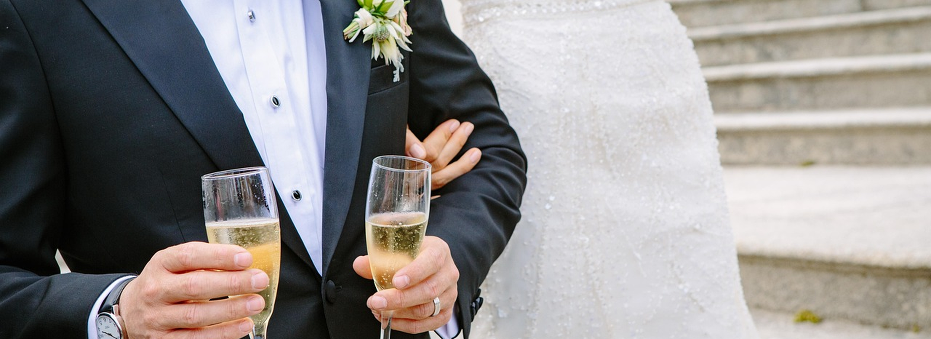 Champagne glasses raised in a warm toast