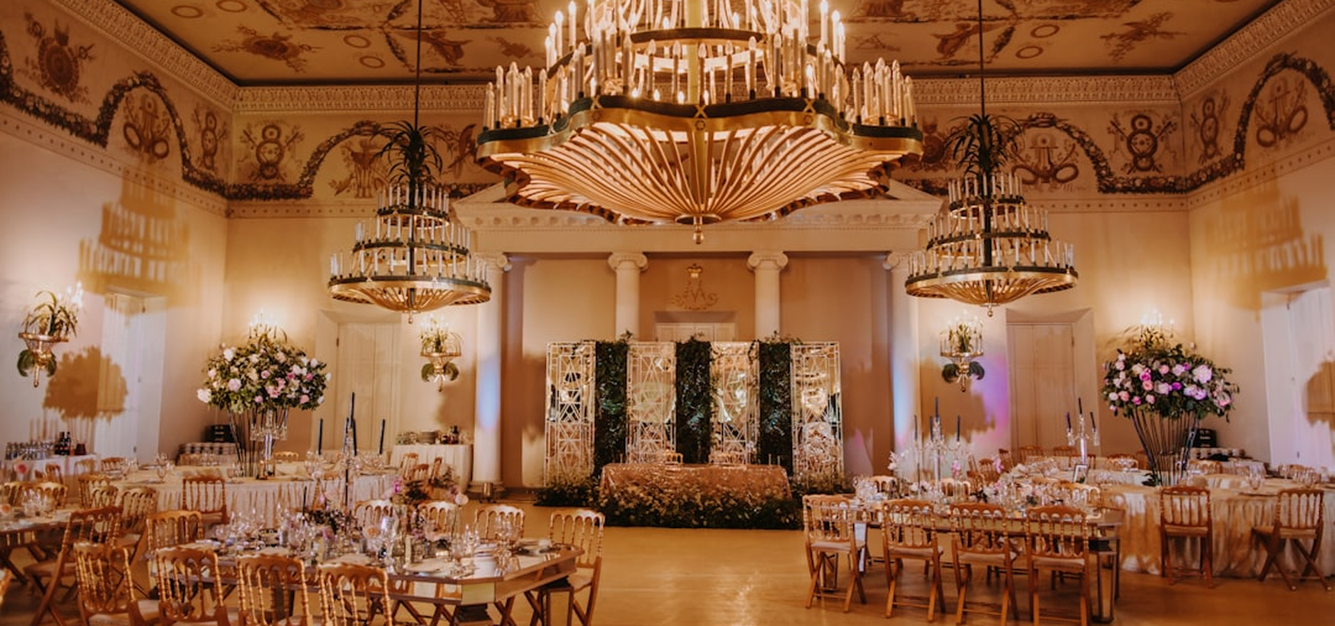 Elegant evening event with guests in a warmly lit luxury venue