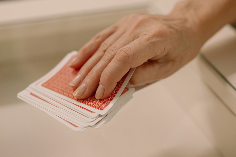 Playing cards arranged on a table in warm elegant lighting